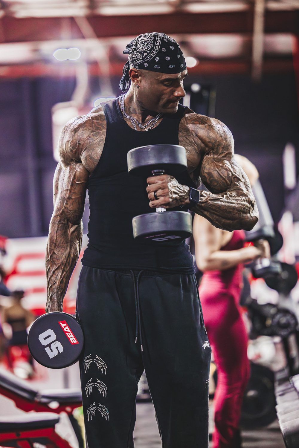 Coach Jae training with a dumbbell